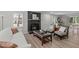 Comfortable living room featuring a cozy fireplace, modern furnishings, and ample natural light at 3 Haggis Ct, Durham, NC 27705