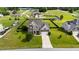 Front aerial view of a home with green lawn at 30 Sunbury Ct, Zebulon, NC 27597