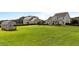 Wide open backyard featuring a shed and well-manicured lawn, perfect for outdoor activities and relaxation at 30 Sunbury Ct, Zebulon, NC 27597