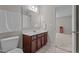 Bathroom with a vanity, toilet, and a view into another room at 30 Sunbury Ct, Zebulon, NC 27597