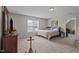 Bedroom with a carpet, a bed, and windows at 30 Sunbury Ct, Zebulon, NC 27597