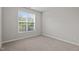 Neutral bedroom with bright window and carpet at 30 Sunbury Ct, Zebulon, NC 27597