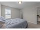 Bedroom featuring carpet, a window for natural light, and neutral paint at 30 Sunbury Ct, Zebulon, NC 27597
