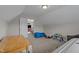 Attic bonus room with a rocking horse, blue storage bag, hardwood table and tanning bed at 30 Sunbury Ct, Zebulon, NC 27597