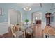 Inviting dining room featuring hardwood floors, modern lighting, and beautiful archways at 30 Sunbury Ct, Zebulon, NC 27597