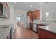 Open-concept kitchen with stainless steel appliances, granite countertops and connected breakfast nook at 30 Sunbury Ct, Zebulon, NC 27597