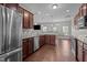Well-equipped kitchen with stainless steel appliances and open layout to the living area at 30 Sunbury Ct, Zebulon, NC 27597