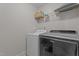This practical laundry room features a washer, dryer, and shelving for organized storage at 30 Sunbury Ct, Zebulon, NC 27597