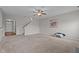 Spacious living room with neutral carpet, staircase, and an open floor plan at 30 Sunbury Ct, Zebulon, NC 27597
