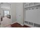 Functional mudroom with built-in storage and bench, leading to a bedroom at 30 Sunbury Ct, Zebulon, NC 27597