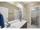 Functional bathroom with a double vanity and access to a toilet and shower at 300 Redhill Rd, Holly Springs, NC 27540
