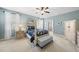 Inviting bedroom with a four-poster bed, soft blue walls, and ample natural light at 300 Redhill Rd, Holly Springs, NC 27540