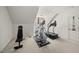 Dedicated gym area with workout equipment, offering a private fitness space within the home at 300 Redhill Rd, Holly Springs, NC 27540