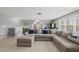 Cozy living room with a large sectional sofa, neutral carpet and soft, natural light at 300 Redhill Rd, Holly Springs, NC 27540
