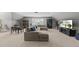 Spacious living room with large sectional sofa, a table with chairs, and entertainment center for relaxation at 300 Redhill Rd, Holly Springs, NC 27540