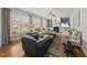 Cozy living room with fireplace, built-in bookshelves, plush seating, and lots of natural light at 300 Redhill Rd, Holly Springs, NC 27540