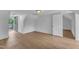 Bright attic room with wood-look floors and an open door leading to the back deck at 302 Hester St, Knightdale, NC 27545