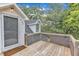 Wooden back deck area provides a private outdoor space with views of the surrounding trees at 302 Hester St, Knightdale, NC 27545