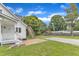 Expansive backyard featuring a brick patio and wooden stairs to a upper deck at 302 Hester St, Knightdale, NC 27545