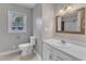 Updated bathroom featuring modern sink, vanity, and fixtures at 302 Hester St, Knightdale, NC 27545