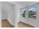 Bright bedroom with natural light has wood flooring and neutral colors at 302 Hester St, Knightdale, NC 27545