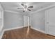 Spacious bedroom featuring hardwood floors and ceiling fan at 302 Hester St, Knightdale, NC 27545