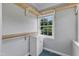 Well-organized closet with built-in shelving and a small window providing natural light at 302 Hester St, Knightdale, NC 27545