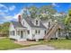 Charming two-story home with a brick chimney, back deck and inviting front porch at 302 Hester St, Knightdale, NC 27545