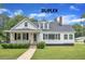 Charming duplex featuring a well-manicured lawn and inviting curb appeal at 302 Hester St, Knightdale, NC 27545