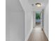 Hallway with tile flooring and a door leading to the outside deck at 302 Hester St, Knightdale, NC 27545