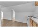 Open kitchen features light wood floors and white walls at 302 Hester St, Knightdale, NC 27545
