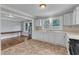 Eat-in kitchen featuring white cabinets and stainless steel refrigerator at 302 Hester St, Knightdale, NC 27545
