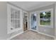 Bright sunroom with tiled floor and access to backyard at 302 Hester St, Knightdale, NC 27545