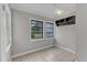 Cozy room with neutral walls, tiled floors, and light fixture at 302 Hester St, Knightdale, NC 27545