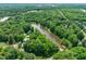 Aerial view of the lake surrounded by lush greenery, showcasing the peaceful setting at 304 W Kirkfield Dr, Cary, NC 27518