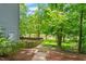 Beautiful backyard features a well-manicured lawn and a partial view of the river at 304 W Kirkfield Dr, Cary, NC 27518
