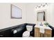 Charming bathroom with wood-paneled walls, a stylish vanity, and modern fixtures at 304 W Kirkfield Dr, Cary, NC 27518