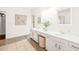 Bright bathroom featuring dual sinks, a large vanity, and modern decor at 304 W Kirkfield Dr, Cary, NC 27518