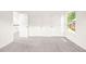 Bedroom featuring neutral carpet, a window, and several doors at 304 W Kirkfield Dr, Cary, NC 27518