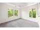 Bedroom featuring neutral carpet, a ceiling with a sky painted mural, and a window at 304 W Kirkfield Dr, Cary, NC 27518
