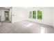 Bedroom featuring neutral carpet, a skylight, and a window at 304 W Kirkfield Dr, Cary, NC 27518
