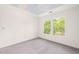 Bedroom featuring neutral carpet, a ceiling with a sky painted mural, and a window at 304 W Kirkfield Dr, Cary, NC 27518