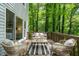 Relaxing deck with comfortable seating and wooded views offers a perfect outdoor space at 304 W Kirkfield Dr, Cary, NC 27518