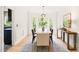 Elegant dining room with a bay window providing natural light and a contemporary chandelier at 304 W Kirkfield Dr, Cary, NC 27518