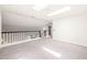 Bright loft area featuring skylights and neutral carpet at 304 W Kirkfield Dr, Cary, NC 27518