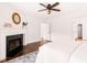 Spacious main bedroom with hardwood floors, a fireplace, and ample natural light at 304 W Kirkfield Dr, Cary, NC 27518