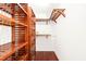 Spacious walk-in closet featuring custom wood shelving for ample storage at 304 W Kirkfield Dr, Cary, NC 27518