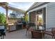 The outdoor deck features a cooking area, dining set, and screened-in porch at 3128 Mountain Hill Dr, Wake Forest, NC 27587