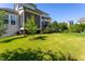 This home features a spacious lawn, mature trees, and outdoor living spaces at 3128 Mountain Hill Dr, Wake Forest, NC 27587