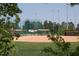 Well-maintained baseball field with green grass and a secure fence, perfect for sports enthusiasts at 3128 Mountain Hill Dr, Wake Forest, NC 27587